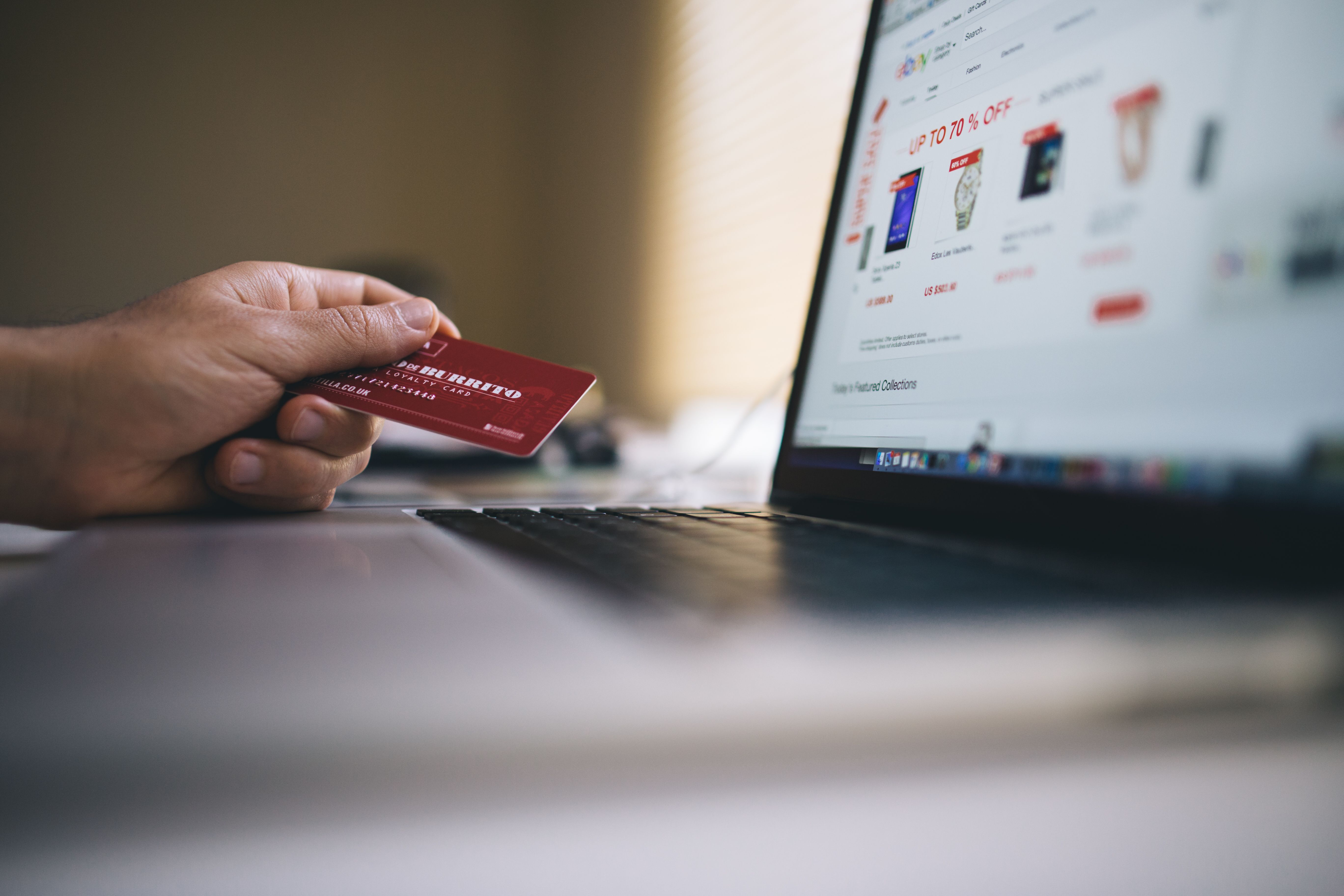 Person paying online by card, e-commerce and payment automation