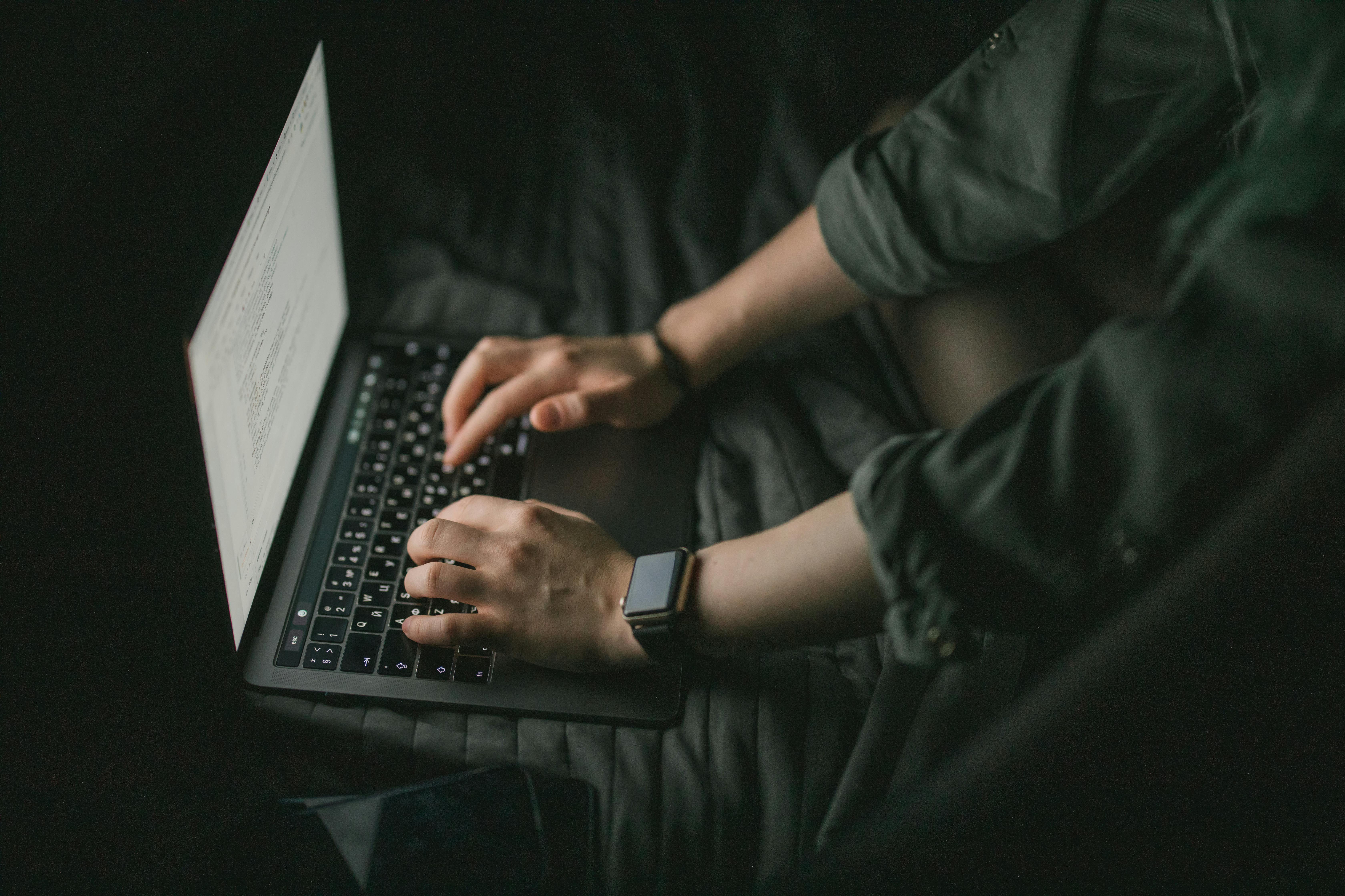 Person on a laptop browsing prebuilt automations or requesting a custom one