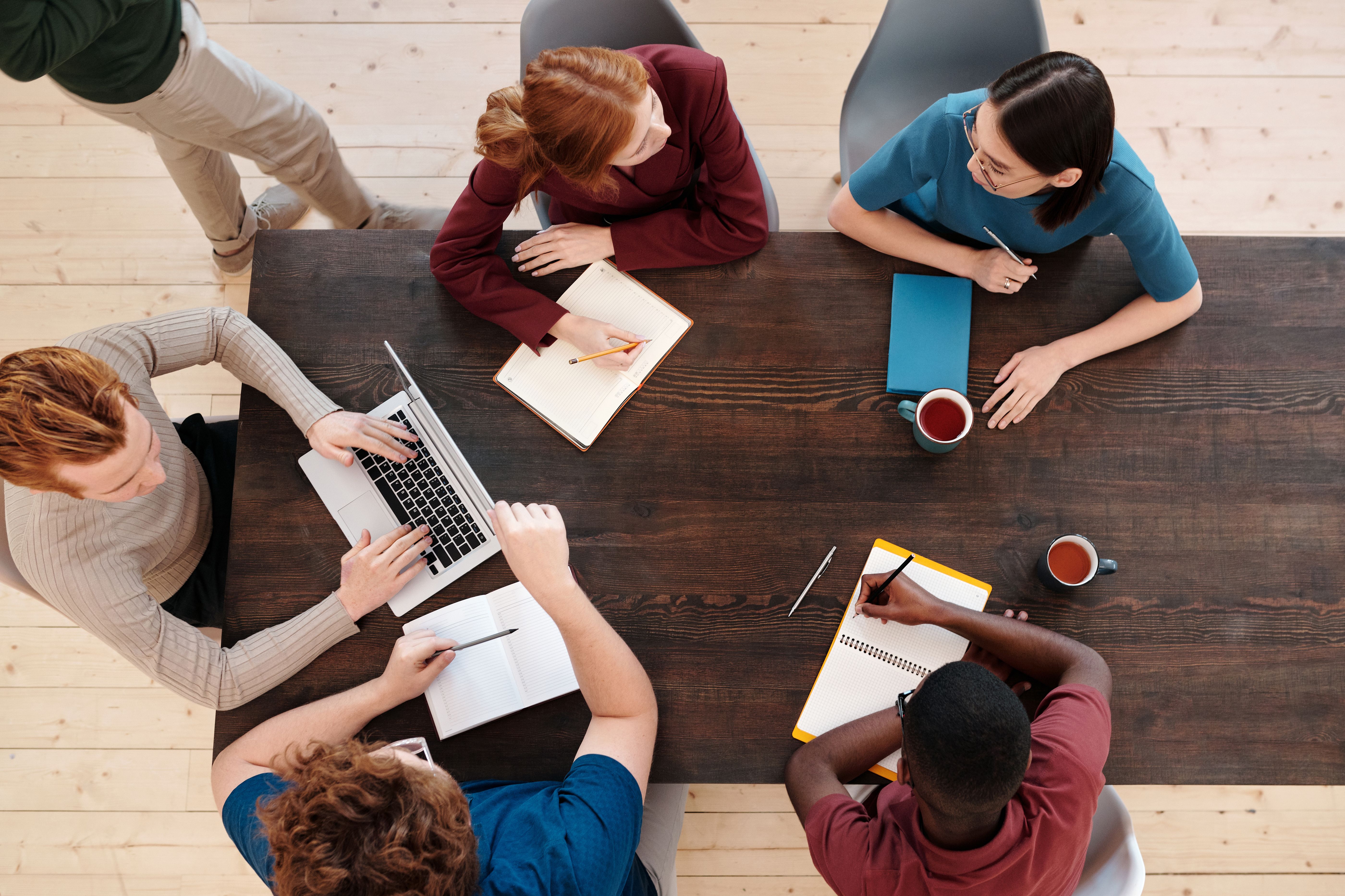 Business team in a hands-on AI training session with ReIntellex
